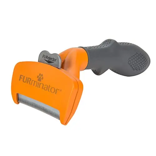 FURminator deshedding tool for medium dogs with short hair on an orange background