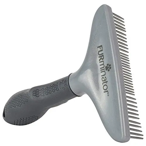 FURminator gray dog and cat grooming rake with rotating teeth