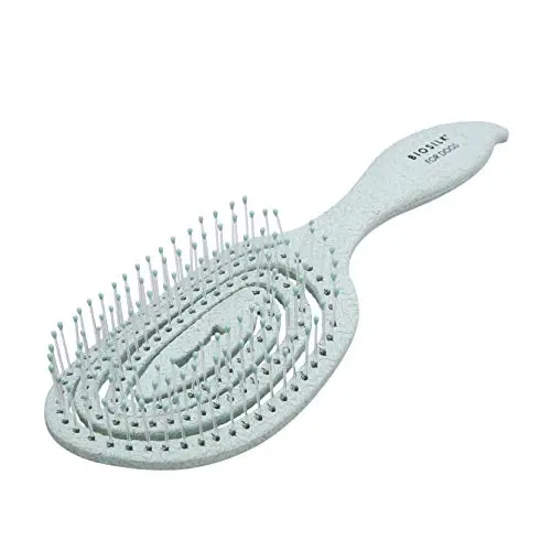 BioSilk for Pets blue pin brush for dogs on a towel