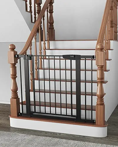 Cumbor black metal baby gate installed at the top of a staircase