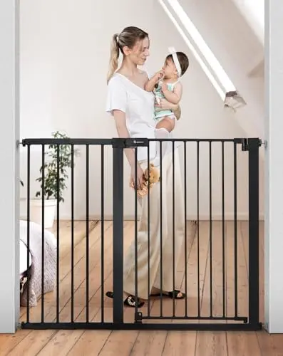 COMOMY extra tall black metal auto-close dog gate installed in a doorway