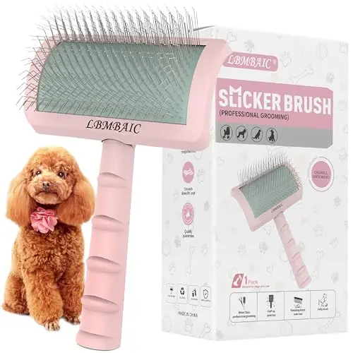 LBMBAIC pink slicker brush grooming a Pomeranian's thick fur