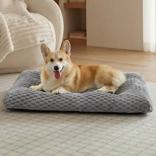 Bedsure grey fluffy bubble fleece dog bed mat with non-slip bottom inside a wire crate.